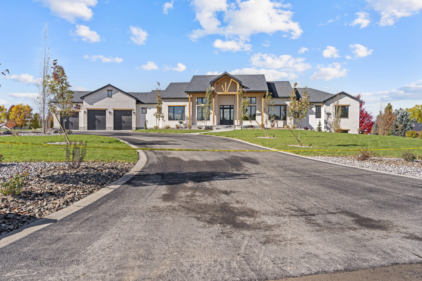 560 Partridge Lane at twilight — brand new all-brick home in Quail Hollow Estates Rexburg Idaho