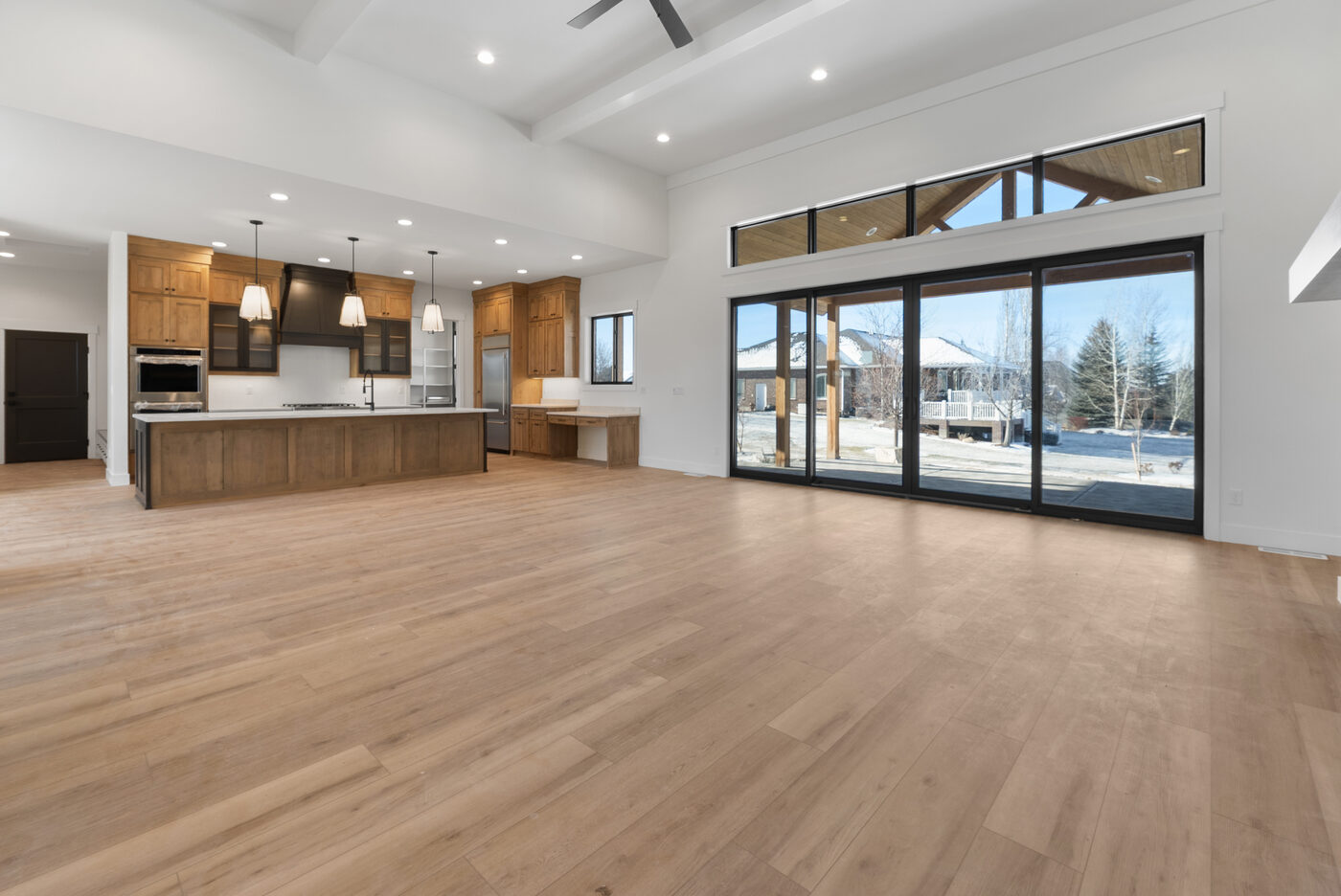 Open concept great room flowing into gourmet kitchen — Rexburg new construction