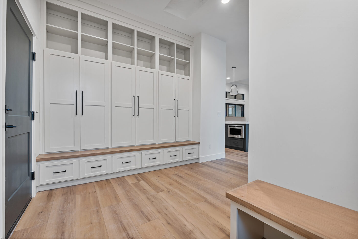 Built-in mudroom with locker system and bench seating — 560 Partridge Lane