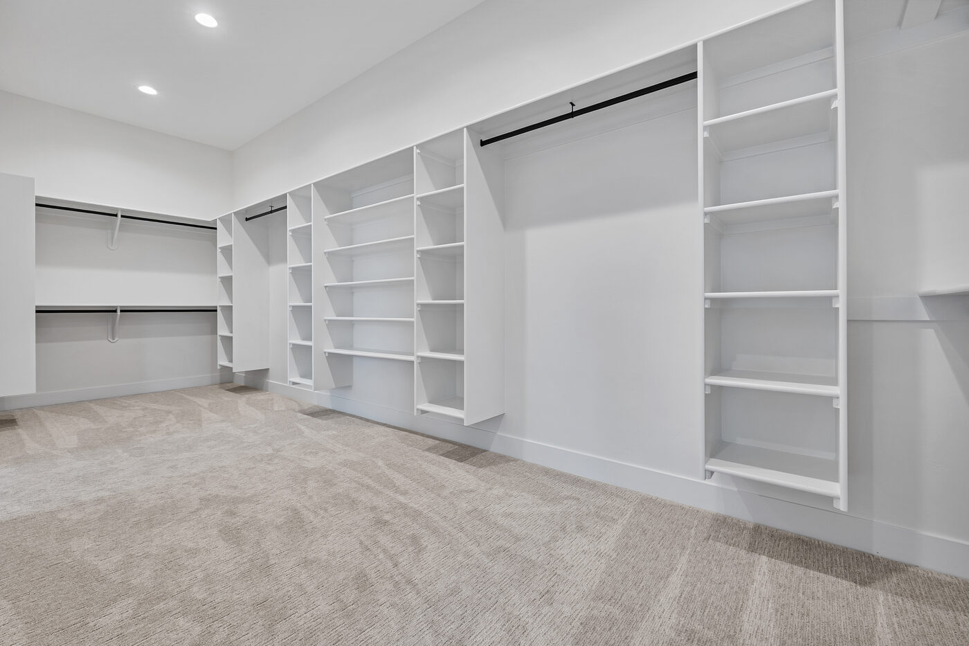 Massive walk-in closet with built-in organization system — primary suite 560 Partridge Lane